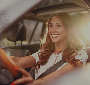 Woman Driving - Maintaining Your New Car